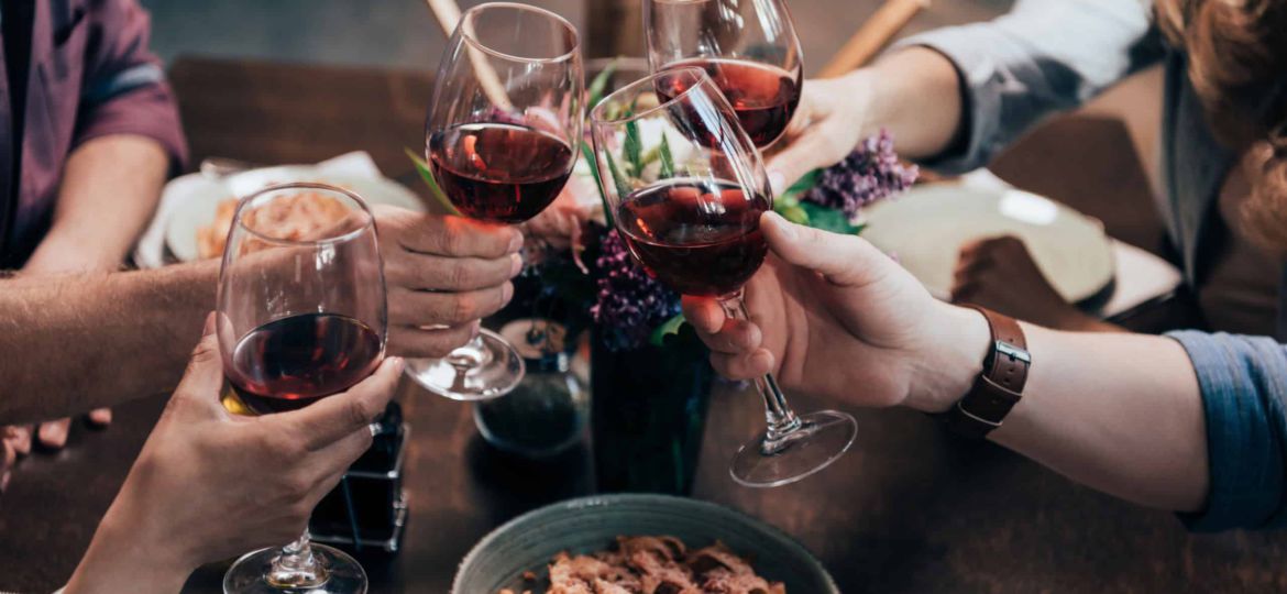 friends drinking wine at dinner