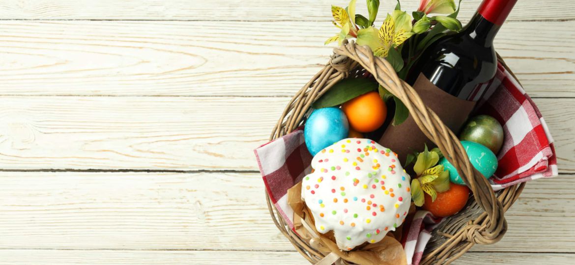 Concept of Easter food on white wooden table